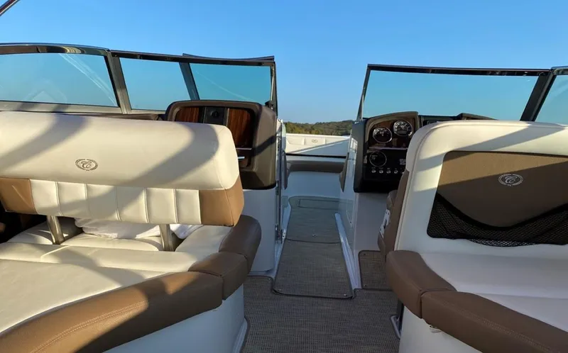 Slide: The Image of Interior of a 2016 Cobalt 296 boat with beige and white seating. - 5
