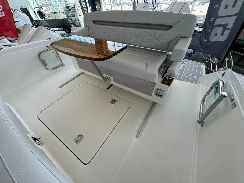 Slide: The Image of 2025 Tiara Yachts 34 LS interior with sleek seating and wooden table. - 10