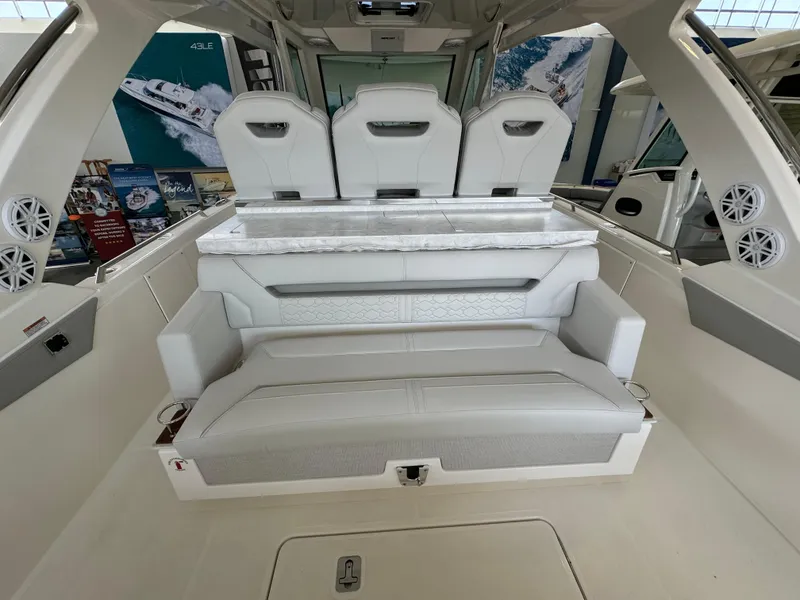 Slide: The Image of 2025 Tiara Yachts 34 LS interior with luxurious seating and modern design. - 13