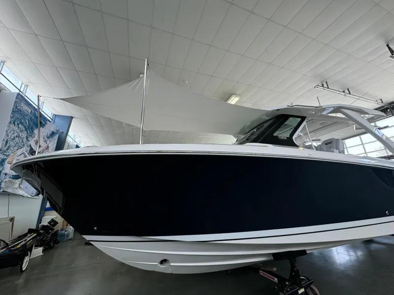 Slide: The Image of 2025 Tiara Yachts 34 LS in showroom, sleek design, modern features. - 2