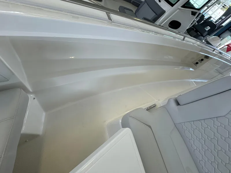 Slide: The Image of 2025 Tiara Yachts 34 LS interior, featuring sleek seating and modern design elements. - 38