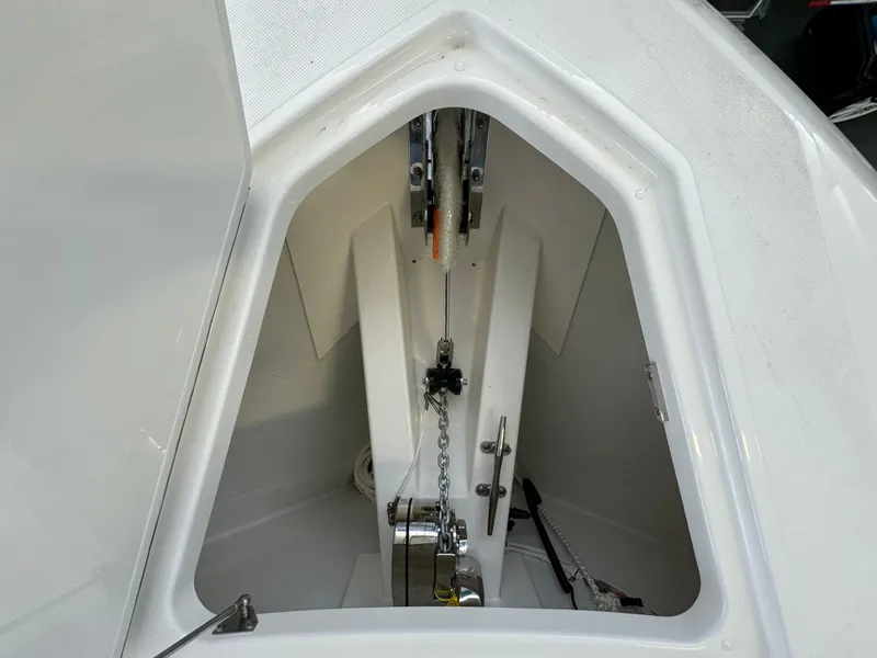 Slide: The Image of Anchor compartment of 2025 Tiara Yachts 34 LS, showcasing chain and winch system. - 44