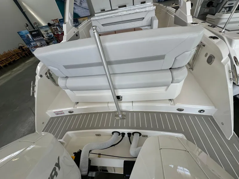 Slide: The Image of 2025 Tiara Yachts 34 LS boat interior with seating and engine view. - 8