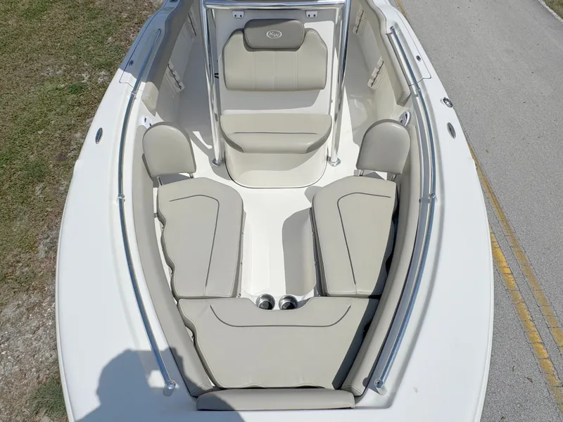 Slide: The Image of 2022 Key West 219 FS boat interior with beige seating and spacious layout. - 11