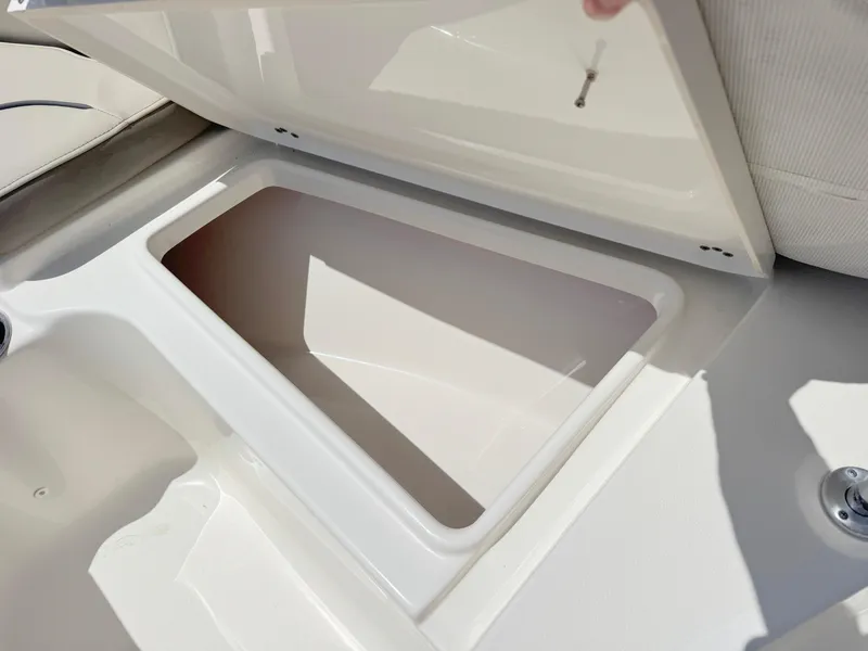 Slide: The Image of Open storage compartment on a 2022 Key West 219 FS boat. - 13