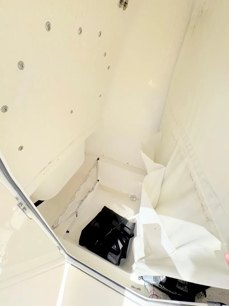 Slide: The Image of Interior view of a 2022 Key West 219 FS boat storage compartment. - 15