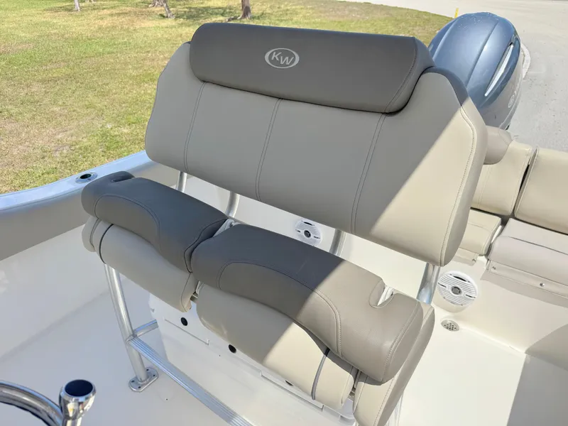 Slide: The Image of 2022 Key West 219 FS boat seating with gray cushions and stainless steel frame. - 16