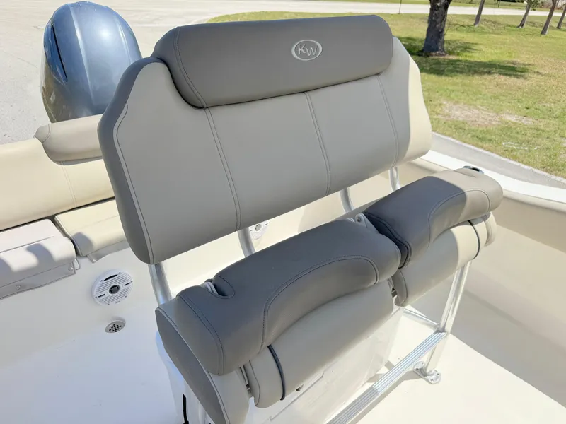 Slide: The Image of 2022 Key West 219 FS boat seat with gray upholstery and KW logo. - 17