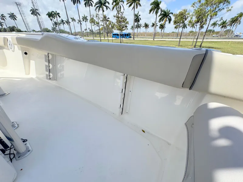 Slide: The Image of 2022 Key West 219 FS boat interior with palm trees in the background. - 24