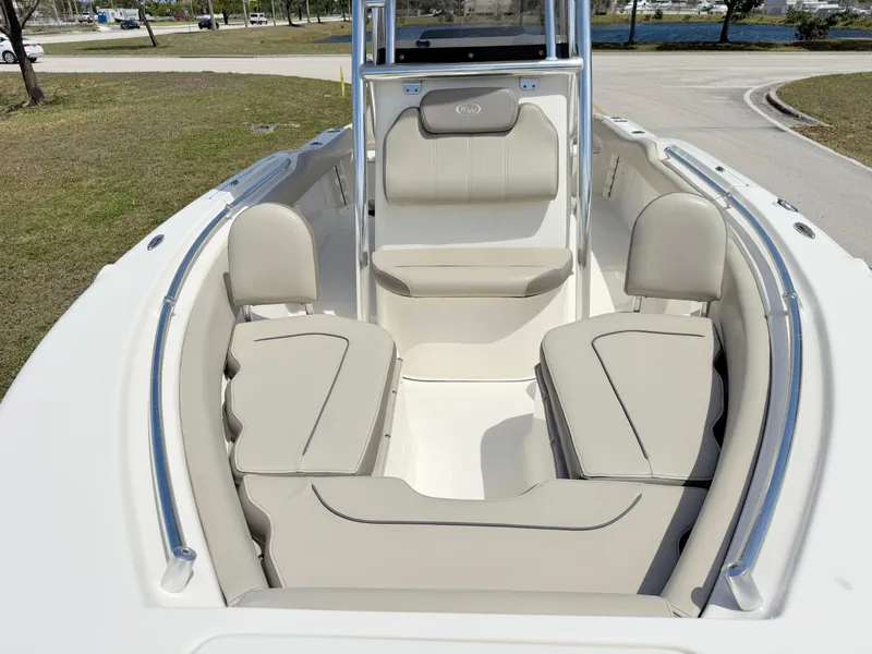 Slide: The Image of 2022 Key West 219 FS boat interior with beige seating and sleek design. - 7