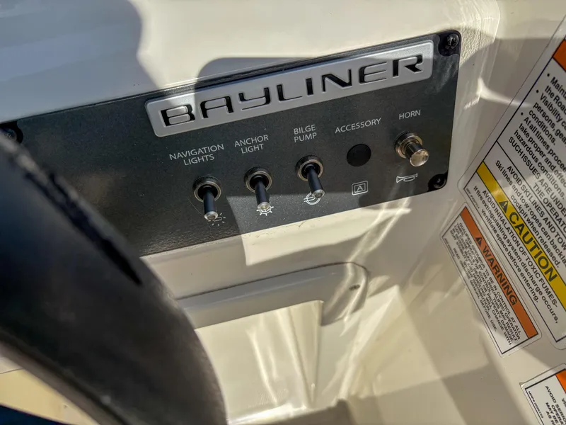 Slide: The Image of Control panel of 2019 Bayliner Element E16 boat with switches and labels. - 12
