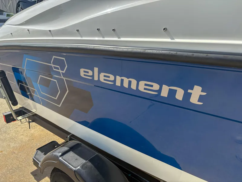 Slide: The Image of 2019 Bayliner Element E16 boat with blue and white exterior design. - 3