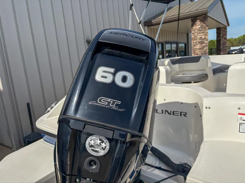 Slide: The Image of 2019 Bayliner Element E16 with Mercury 60 CT outboard motor, parked near a building. - 5