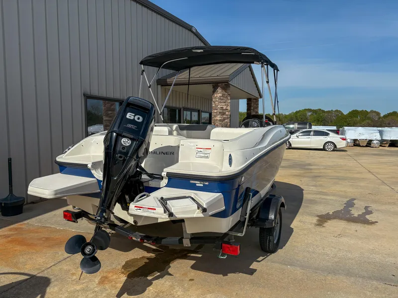 Slide: The Image of 2019 Bayliner Element E16 boat with 60 HP engine, parked outdoors. - 6