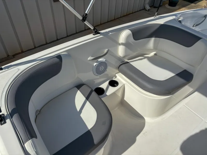 Slide: The Image of 2019 Bayliner Element E16 boat interior with gray and white seating. - 9