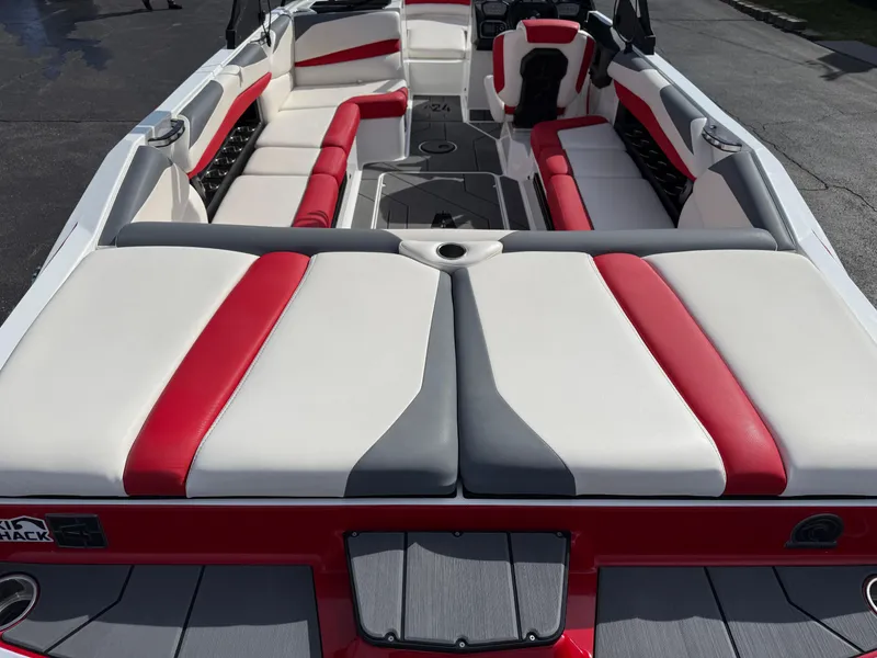 Slide: The Image of 2020 Axis A24 boat interior with red and white seating, spacious layout. - 10