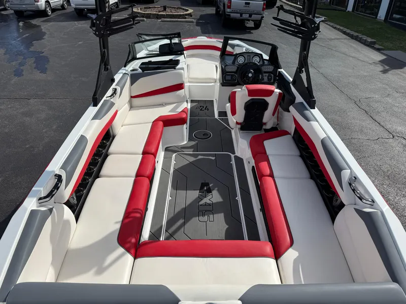 Slide: The Image of 2020 Axis A24 boat interior with red and white seating, sleek design, and modern dashboard. - 12