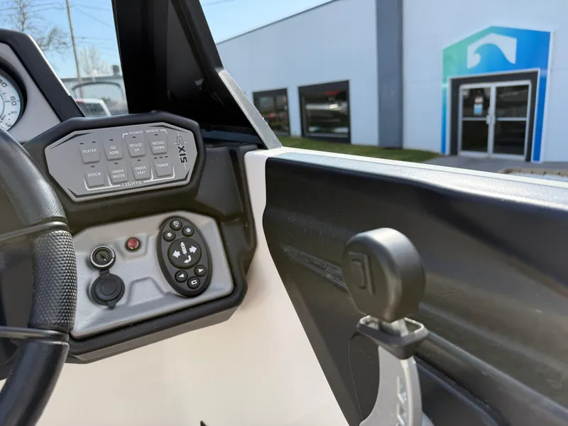 Slide: The Image of Interior view of 2020 Axis A24 boat dashboard and controls. - 27