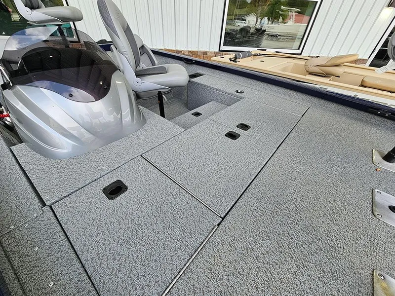Slide: The Image of 2025 G3 Sportsman 1810 PFX boat interior with storage compartments and seating. - 10