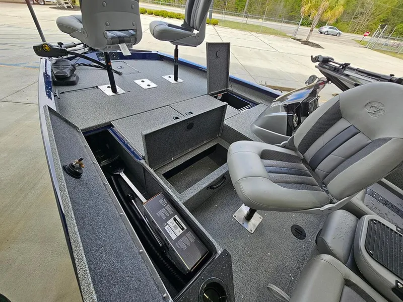 Slide: The Image of 2025 G3 Sportsman 1810 PFX boat interior with seating and storage compartments. - 11