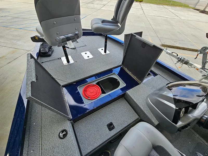 Slide: The Image of 2025 G3 Sportsman 1810 PFX boat interior with open storage compartments and seating. - 12