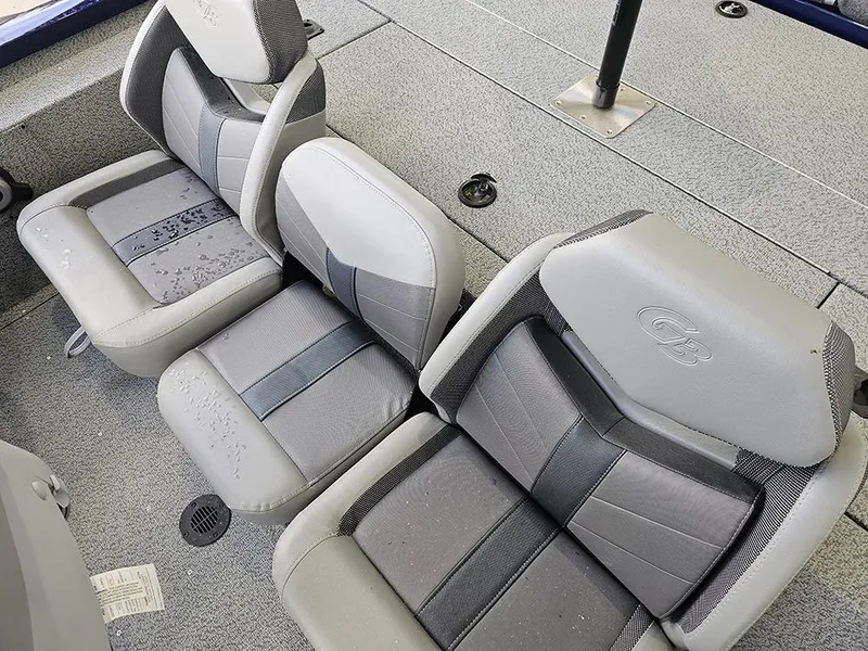 Slide: The Image of 2025 G3 Sportsman 1810 PFX boat seats, gray and black upholstery, spacious interior design. - 17