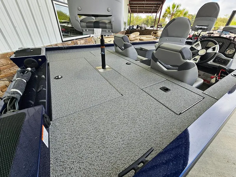 Slide: The Image of 2025 G3 Sportsman 1810 PFX boat interior with seating and steering console. - 5