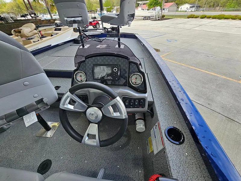 Slide: The Image of 2025 G3 Sportsman 1810 PFX boat interior with steering wheel and dashboard controls. - 8