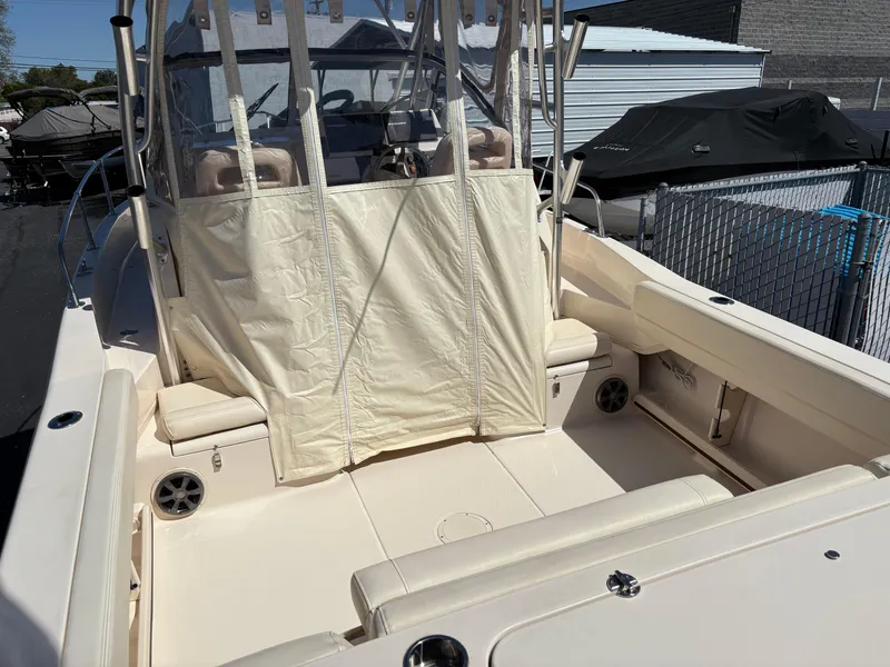 Slide: The Image of 2021 Grady-White 232 Gulfstream boat interior with seating and covered console. - 5