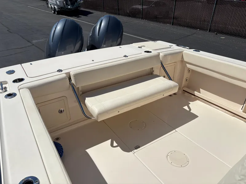 Slide: The Image of 2021 Grady-White 232 Gulfstream boat interior with foldable seating and dual engines. - 6