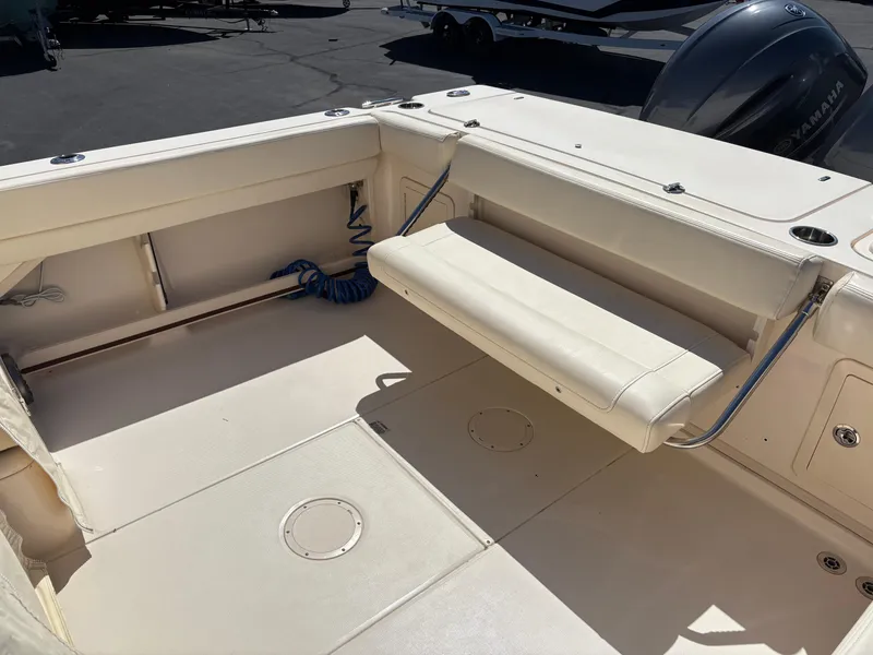 Slide: The Image of 2021 Grady-White 232 Gulfstream boat interior with foldable seating and Yamaha engine. - 7
