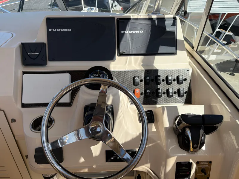 Slide: The Image of Helm of 2021 Grady-White 232 Gulfstream with Furuno navigation system and controls. - 9