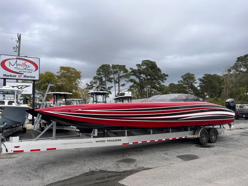 Slide: The Image of Red and black 2020 Wright Performance 360 boat on trailer at marina. - 1