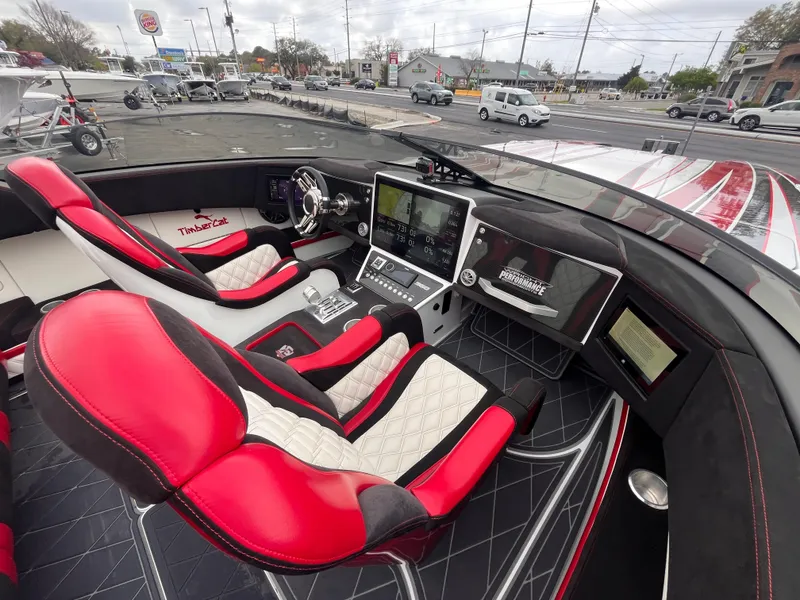 Slide: The Image of Luxurious 2020 Wright Performance 360 boat interior with red and white seating, advanced dashboard controls. - 18