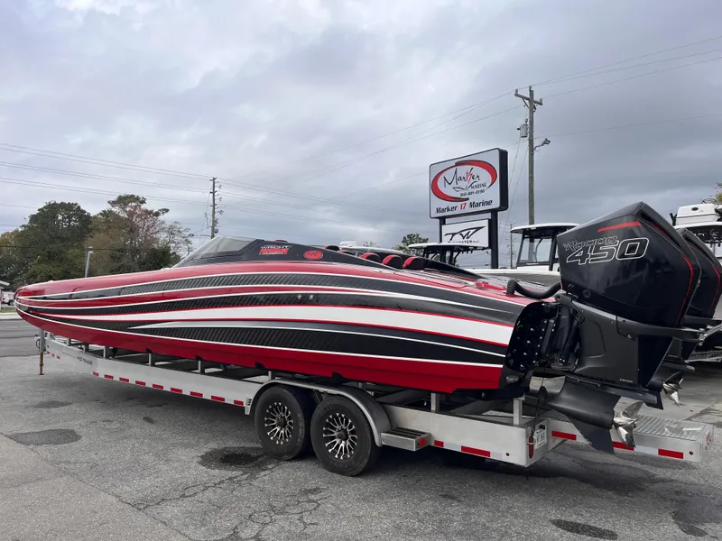 Slide: The Image of 2020 Wright Performance 360 boat on trailer, featuring sleek red and black design. - 2