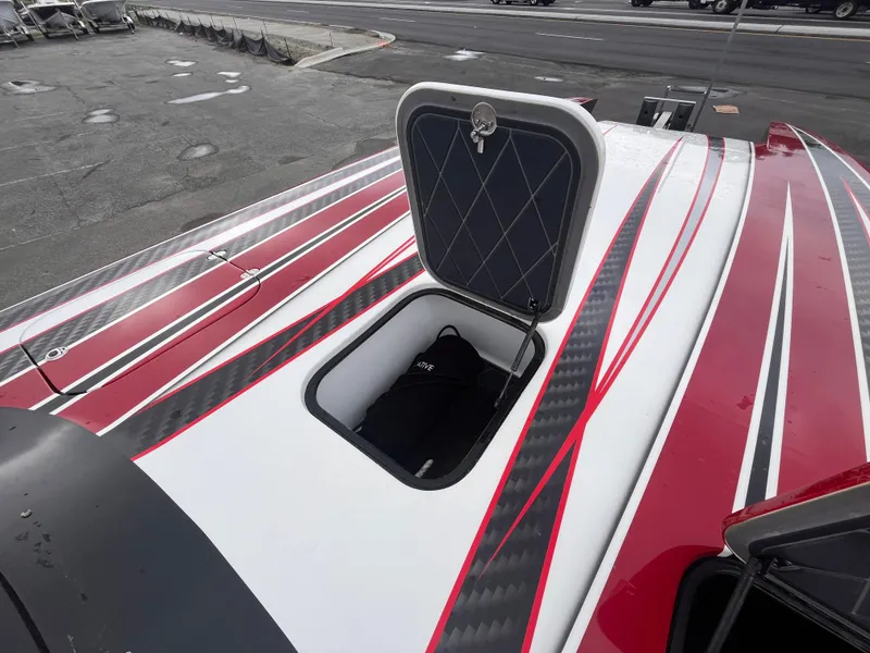 Slide: The Image of Open hatch on 2020 Wright Performance 360 boat with red and black stripes. - 22