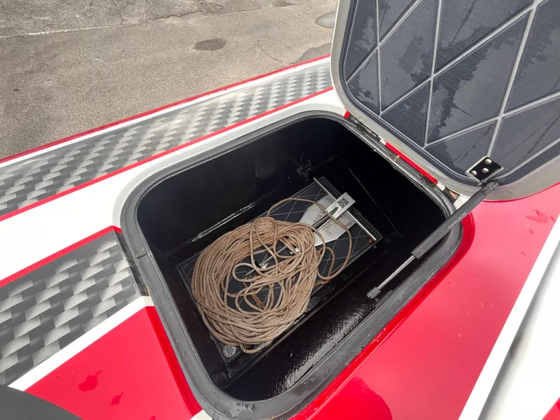 Slide: The Image of Open storage compartment on 2020 Wright Performance 360 boat with rope inside. - 23