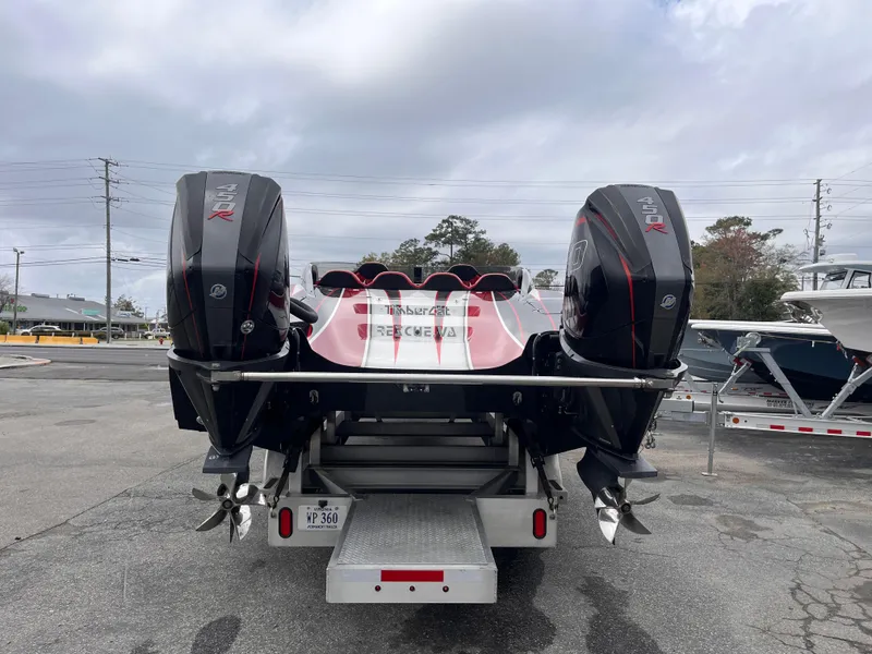 Slide: The Image of 2020 Wright Performance 360 boat with dual outboard engines, parked on a trailer. - 4