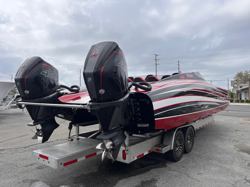 Slide: The Image of 2020 Wright Performance 360 boat on trailer with dual outboard motors, sleek red and black design. - 5