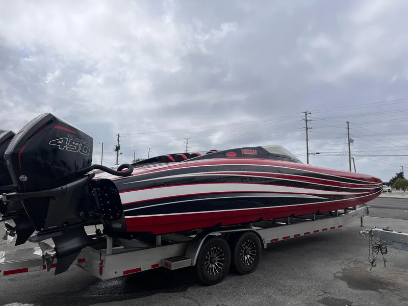 Slide: The Image of 2020 Wright Performance 360 boat on trailer, featuring sleek red, black, and white design. - 6