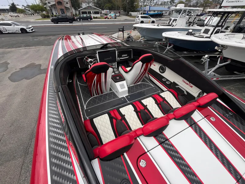 Slide: The Image of Wright Performance 360 boat interior, 2020 model, featuring red and white seating with carbon fiber accents. - 9