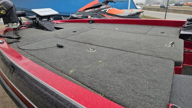 Slide: The Image of 2017 Ranger Z518 boat deck with carpeted surface and fishing equipment. - 6