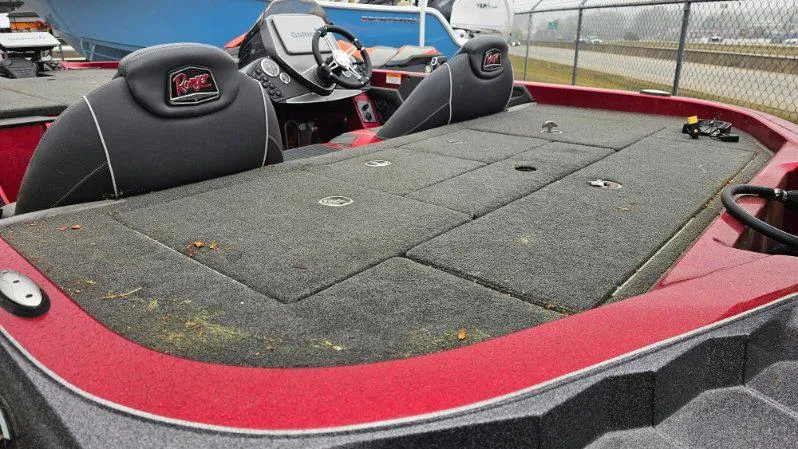 Slide: The Image of 2017 Ranger Z518 boat interior with red accents and dual seats. - 7