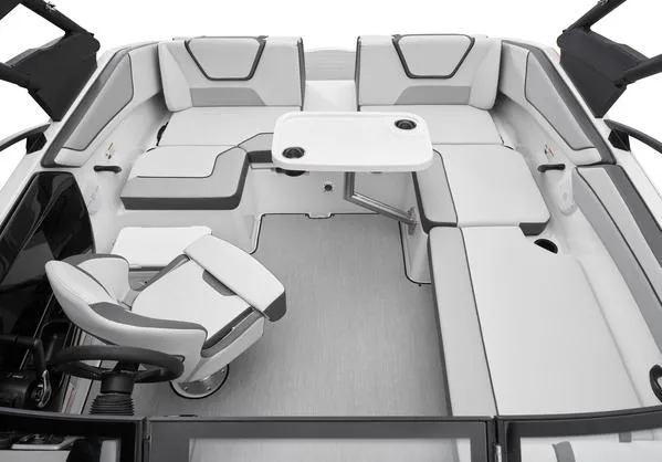 Slide: The Image of 2025 Yamaha Boats AR220 interior with sleek seating and a central table. - 10