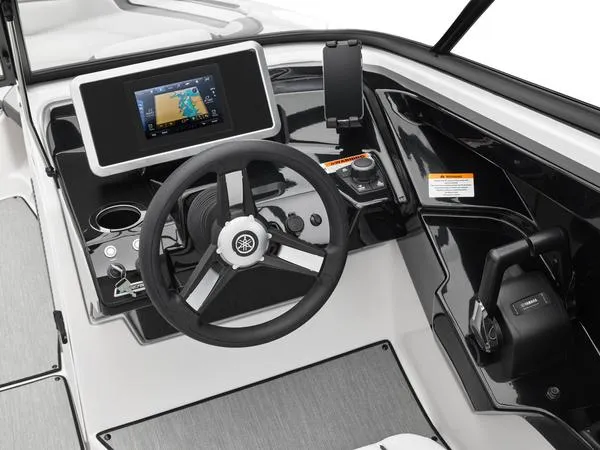 Slide: The Image of 2025 Yamaha Boats AR250 dashboard with steering wheel, touchscreen display, and controls. - 9