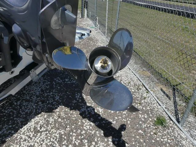 Slide: The Image of Propeller of 2025 Key West 188 BR boat, shiny metal blades, outdoor setting. - 10