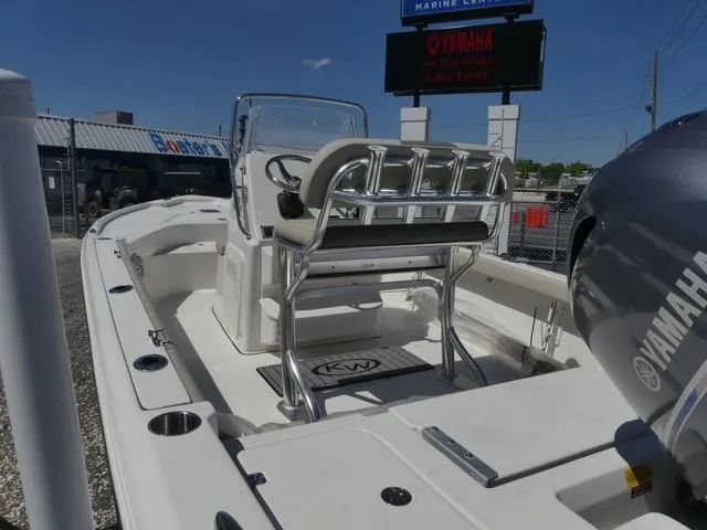 Slide: The Image of 2025 Key West 188 BR boat with Yamaha engine, docked at a marine center. - 11