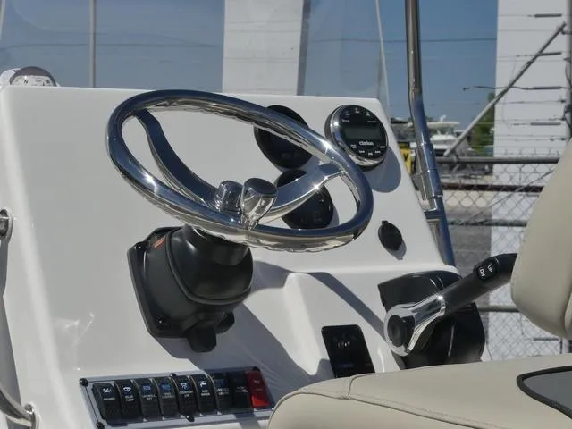 Slide: The Image of Steering console of 2025 Key West 188 BR boat with controls and gauges. - 12
