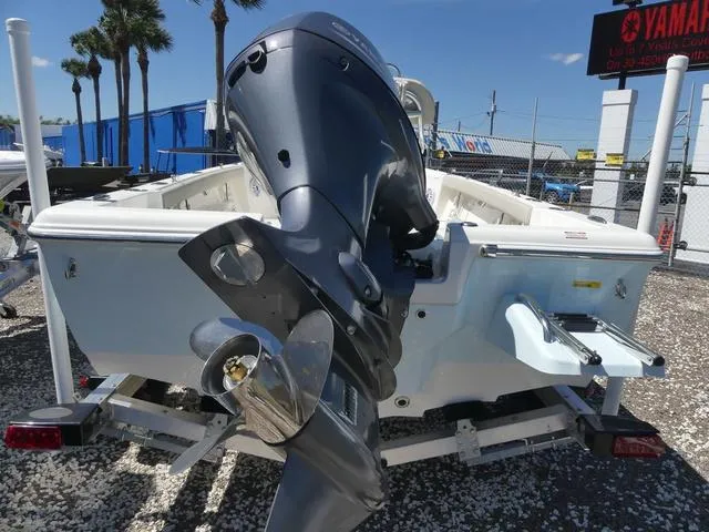 Slide: The Image of 2025 Key West 188 BR boat with outboard motor, displayed outdoors on a trailer. - 5