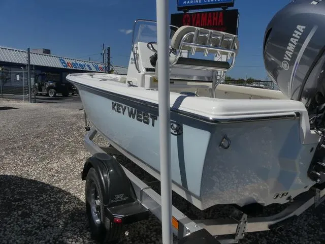 Slide: The Image of 2025 Key West 188 BR boat on trailer, featuring Yamaha engine, parked outdoors. - 6